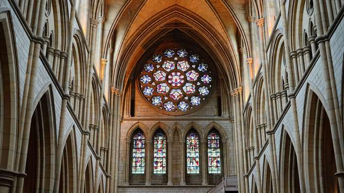 Gothic Cathedral Interior with Rose Window and Stained Glass