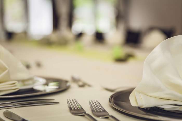 Table setting with cutlery and napkins
