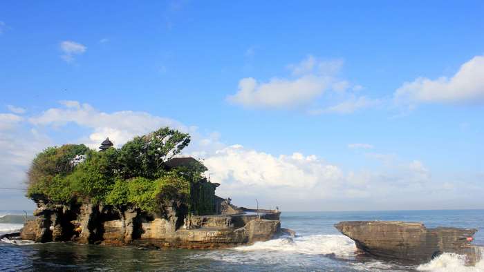 Tanah Lot temple on a rocky island in Bali