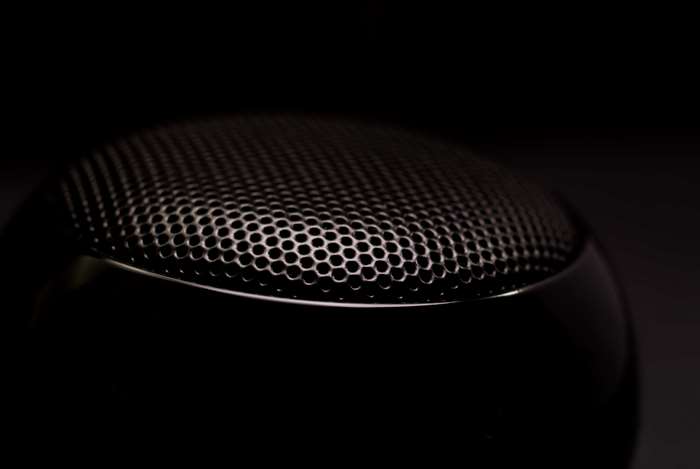 Black speaker grill in dark setting 4K
