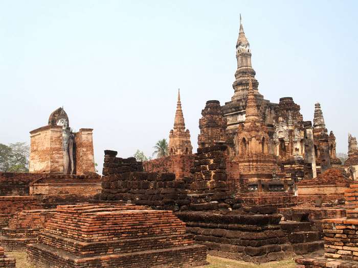 Ancient Buddhist temple ruins with Buddha statue