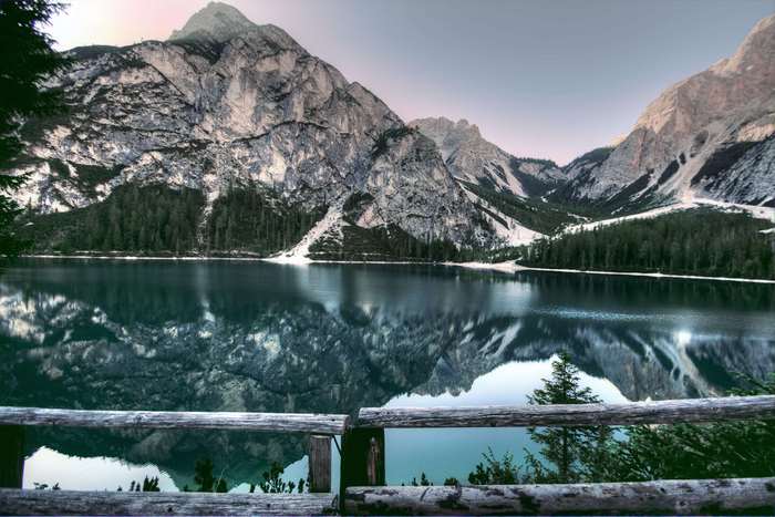 Lake reflection of rocky mountains and forest