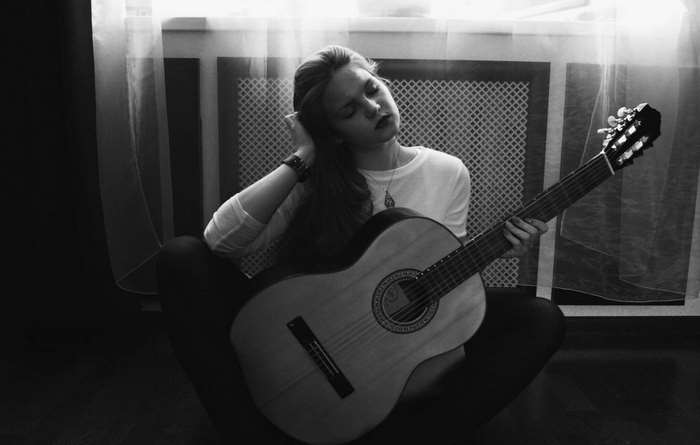 Woman playing a classical guitar