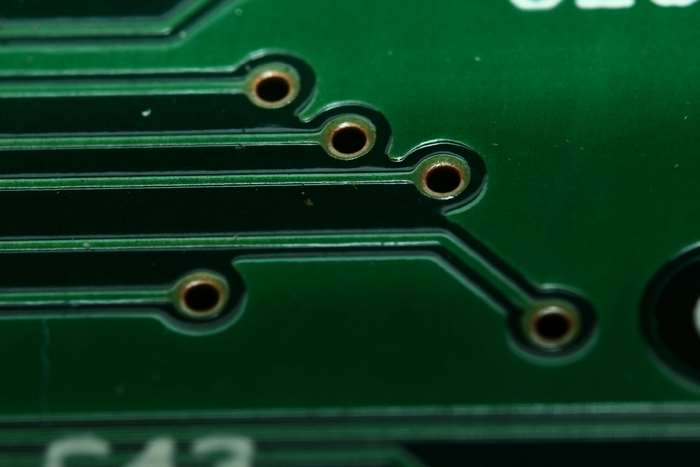 Macro photography of a printed circuit board with vias