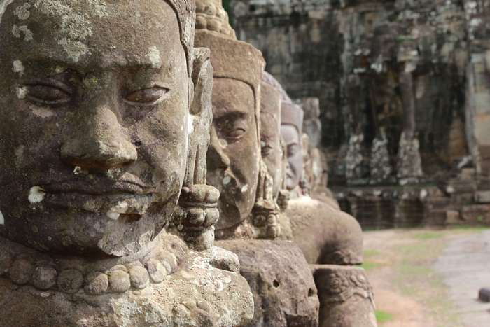 Stone sculptures of faces in Angkor, Cambodia
