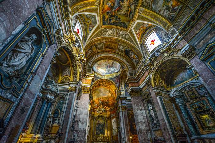 Interior of a richly decorated church in Rome, Italy