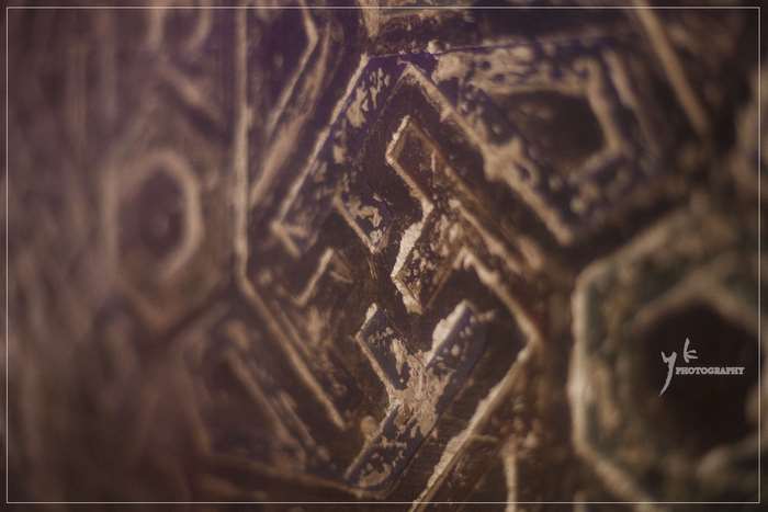 Close-up of ancient swastika symbol in Mughal architecture