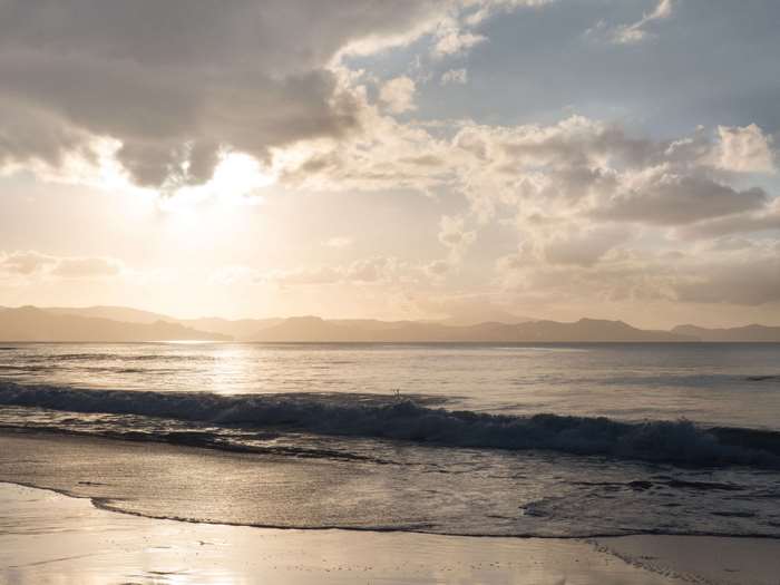Golden Hour Beach with Mountains and Waves 4K