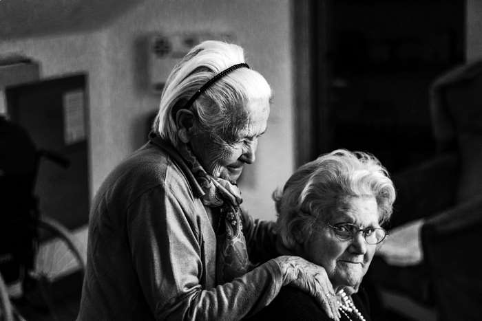 Two elderly women in a retirement home