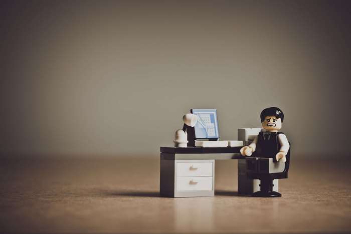 Lego businessman at desk with computer