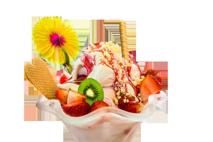 Ice cream sundae with strawberries, kiwi, and a flower