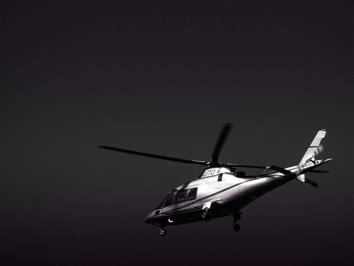 Black and white helicopter in flight