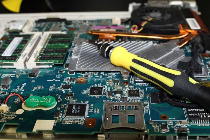 Laptop motherboard repair with screwdriver