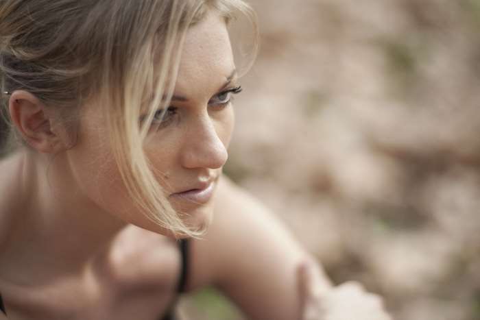 Woman with blonde hair looking to the side