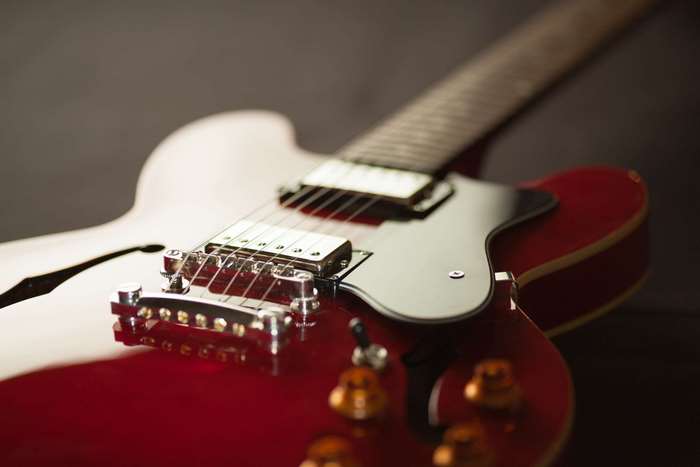 Close up of a red electric guitar