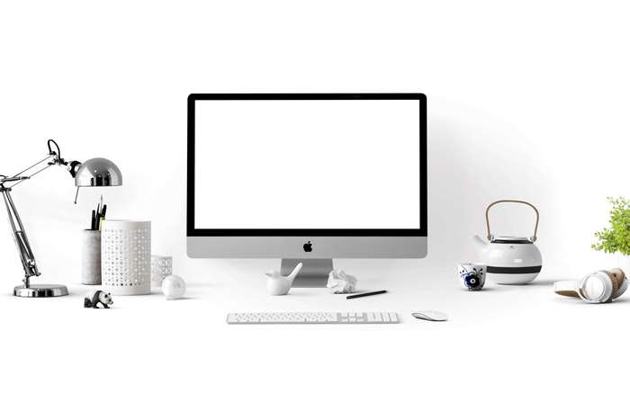 Apple iMac computer setup with desk accessories