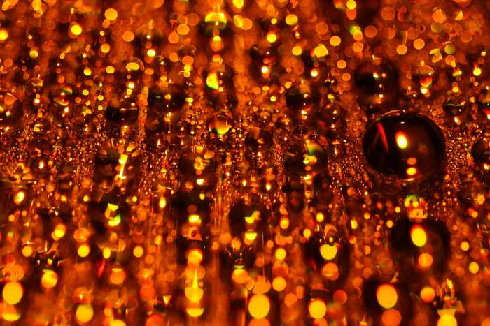 Abstract golden bokeh water droplets 4K