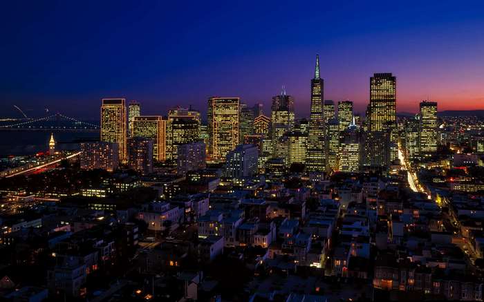 San Francisco skyline at dusk with Bay Bridge