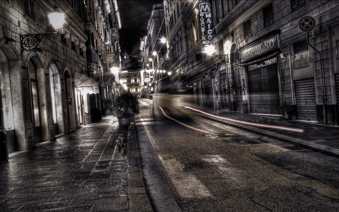 Night street with light trails and buildings