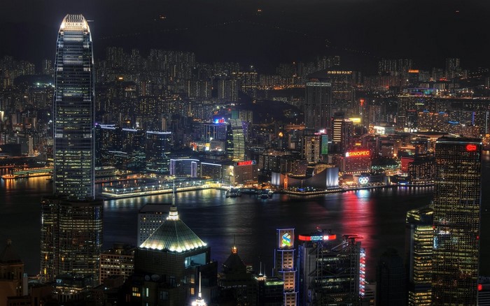 Hong Kong skyline at night with skyscrapers and harbor