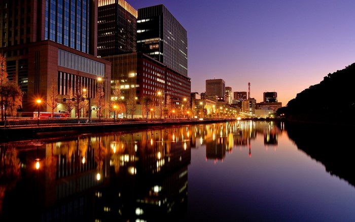 Tokyo cityscape at dusk with river reflections