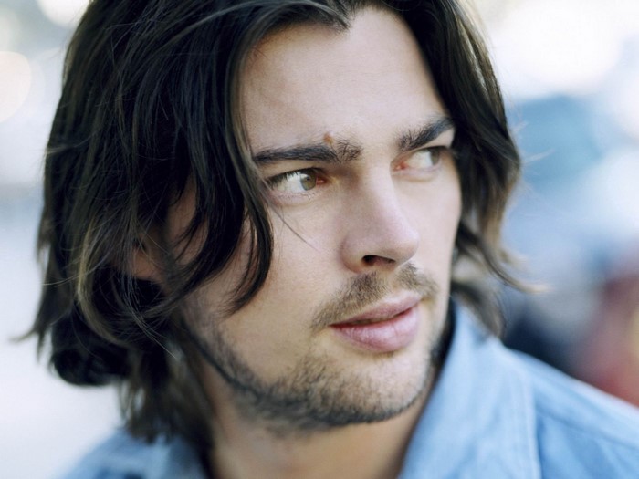 Karl Urban with long brunette hair