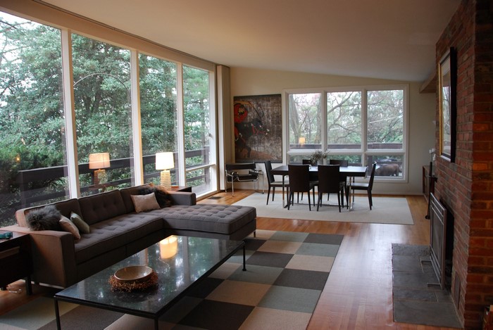 Modern living room with large windows and fireplace