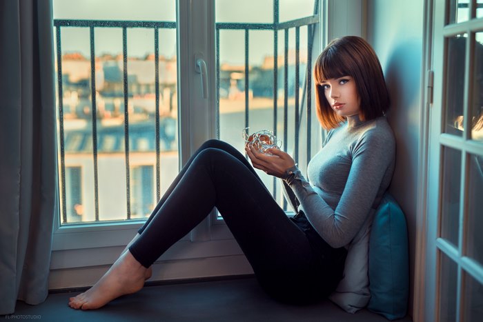 Marie Grippon Sitting by Window in Thoughtful Pose