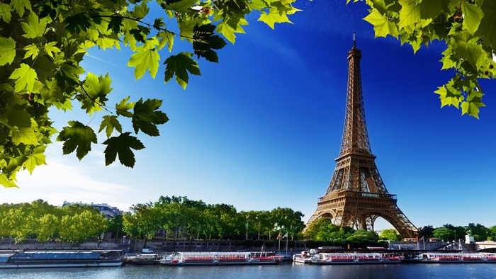 Eiffel Tower in Paris Under Clear Blue Sky 4K