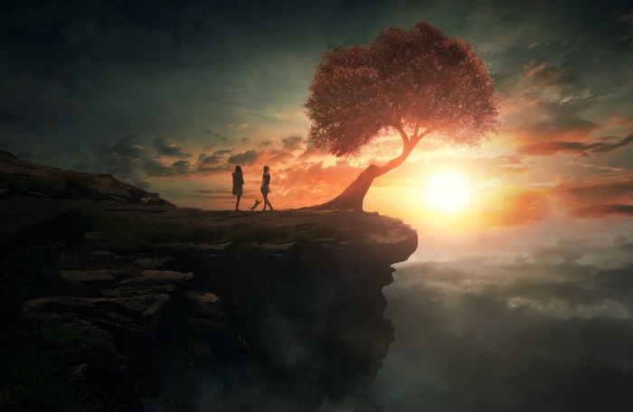 Two figures and a tree on a cliff at sunset