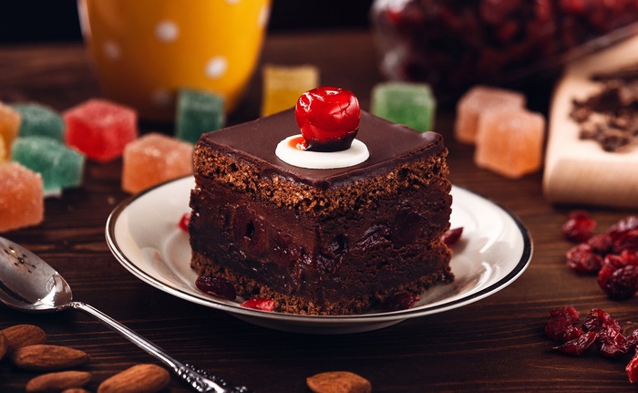 Decadent Chocolate Cake with Cherry on Top