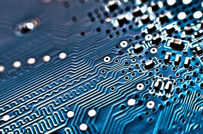 Close-up of a blue circuit board with electronic components