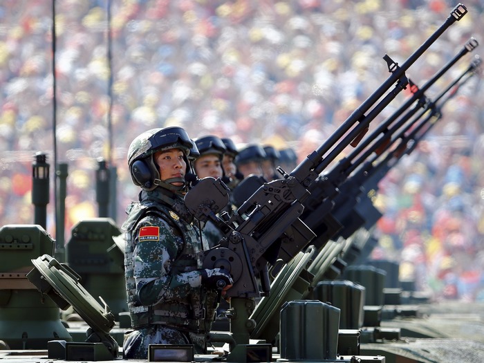 Chinese soldiers with machine guns in a parade