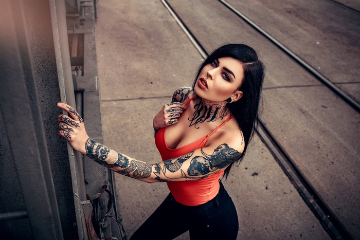 Woman with tattoos and black hair
