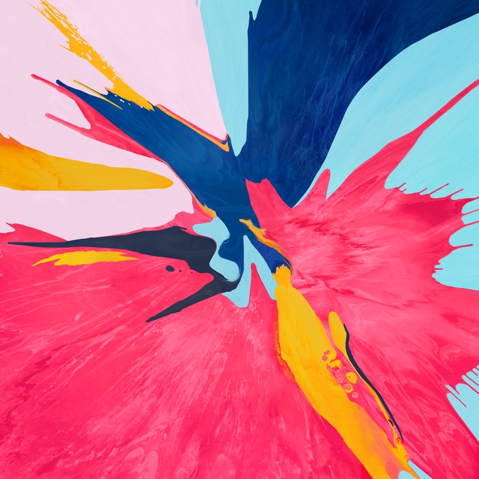 Colorful paint splash on pink background