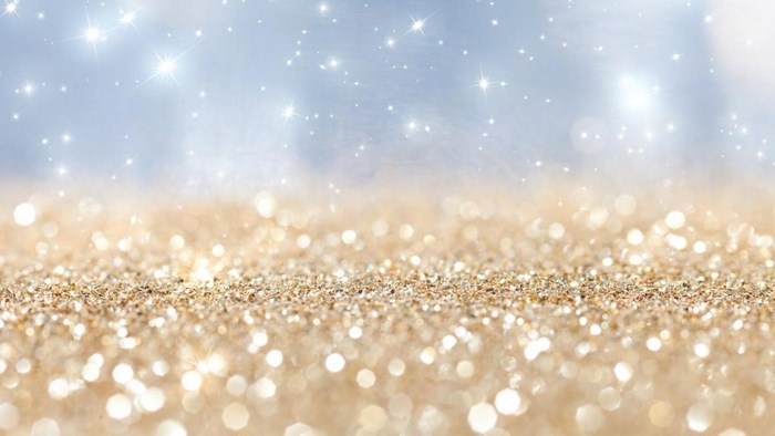 Sparkling gold glitter and blue bokeh lights