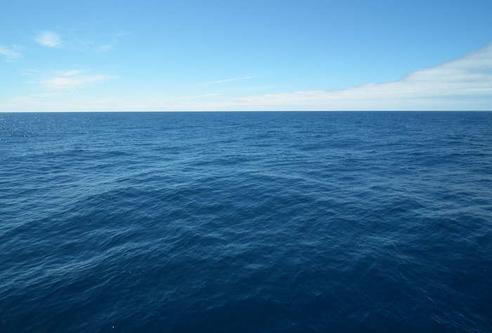 Ocean Horizon with Blue Sky and Clouds