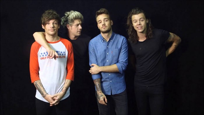 One Direction members posing for a photo