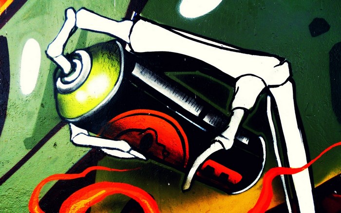 Graffiti skeleton hand holding spray can