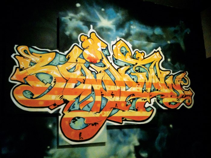 Graffiti art with orange and blue stripes