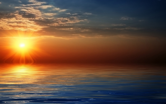 Sunset over the ocean with reflection