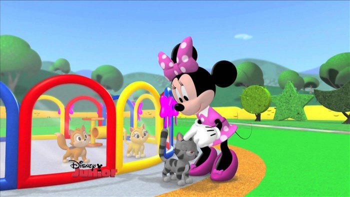 Minnie Mouse with kittens on a playground