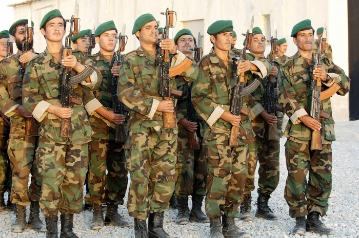 Soldiers in camouflage uniforms holding rifles