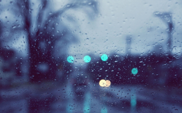 Rainy day through a window with bokeh lights