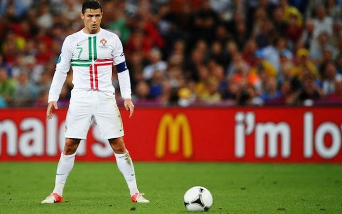 Cristiano Ronaldo in Portugal uniform with soccer ball