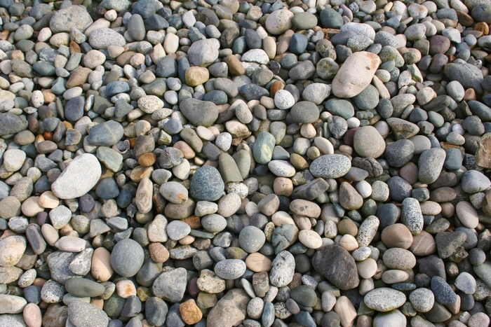 A pile of various sized and colored stones.