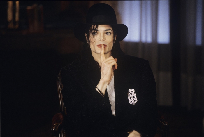 Michael Jackson wearing a hat and jacket