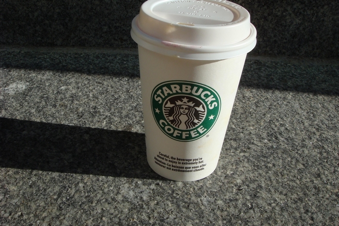 Starbucks coffee cup on granite steps
