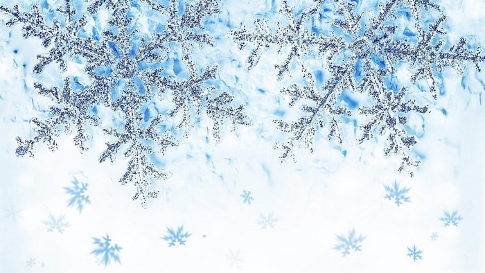 Glittering snowflakes on a blue and white background