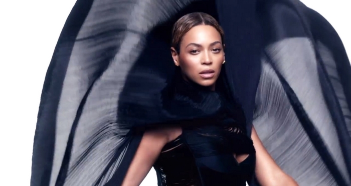 Beyoncé in black dress with flowing fabric
